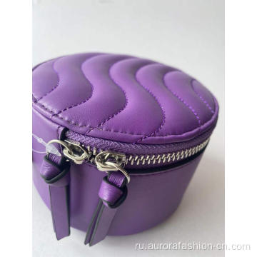 Фиолетовый косметический футляр, похожий на коробку конфет